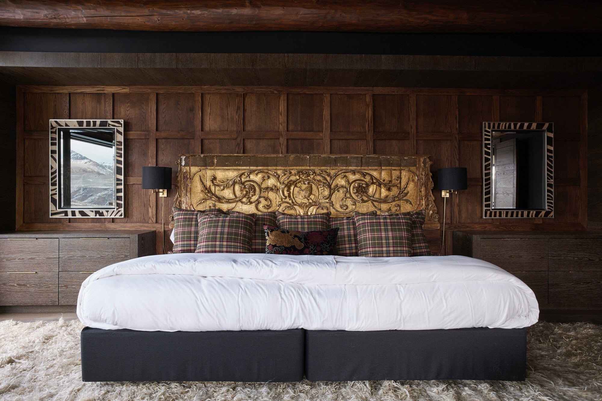 Bedroom showcasing antique patinated headboard for a project based in Telluride, Colorado.