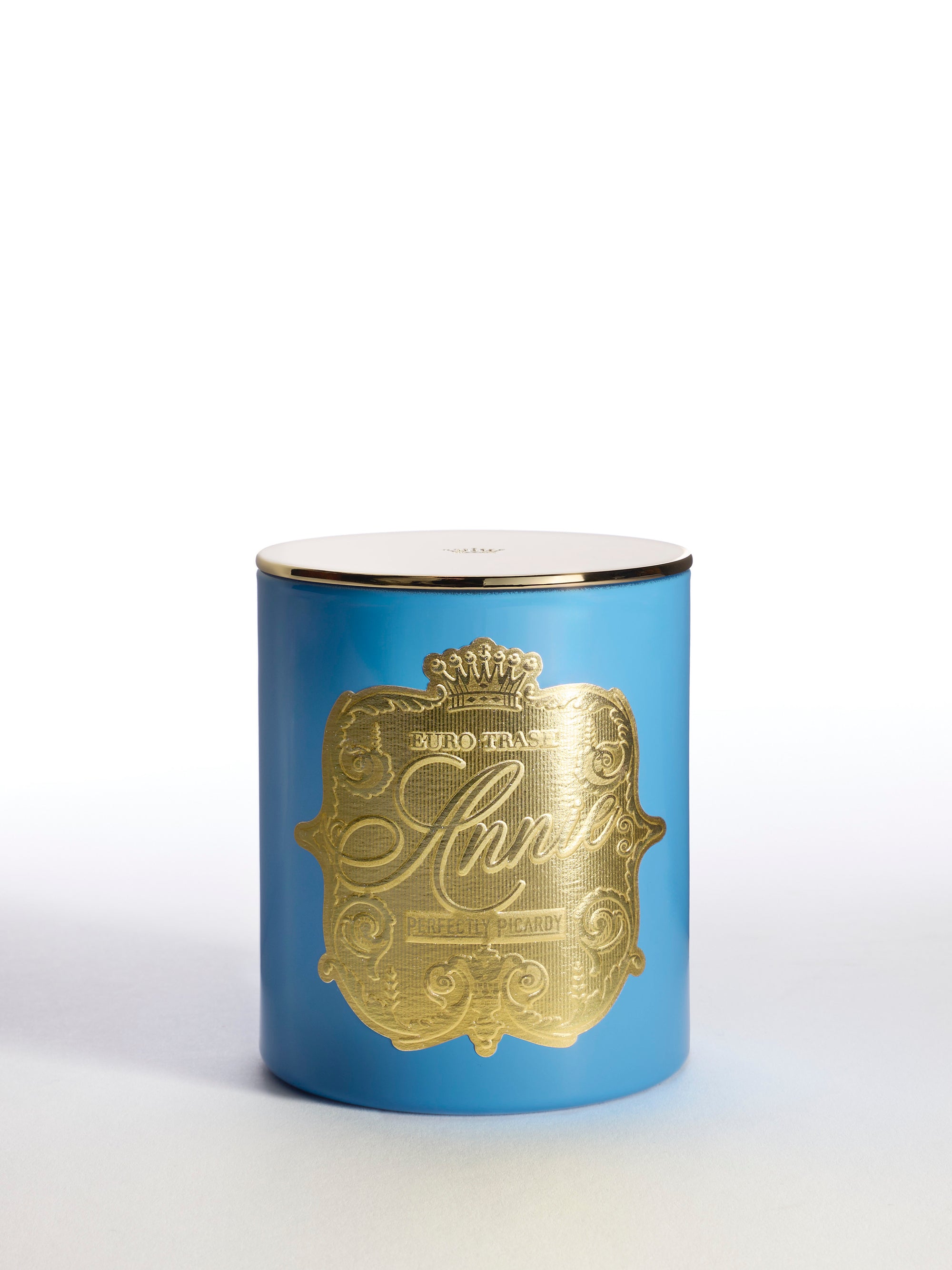 A blue cylindrical soy candle jar with a gold lid and ornate gold Amié label displays decorative designs. The "Perfectly Picardy" candle is shown against a plain white background.