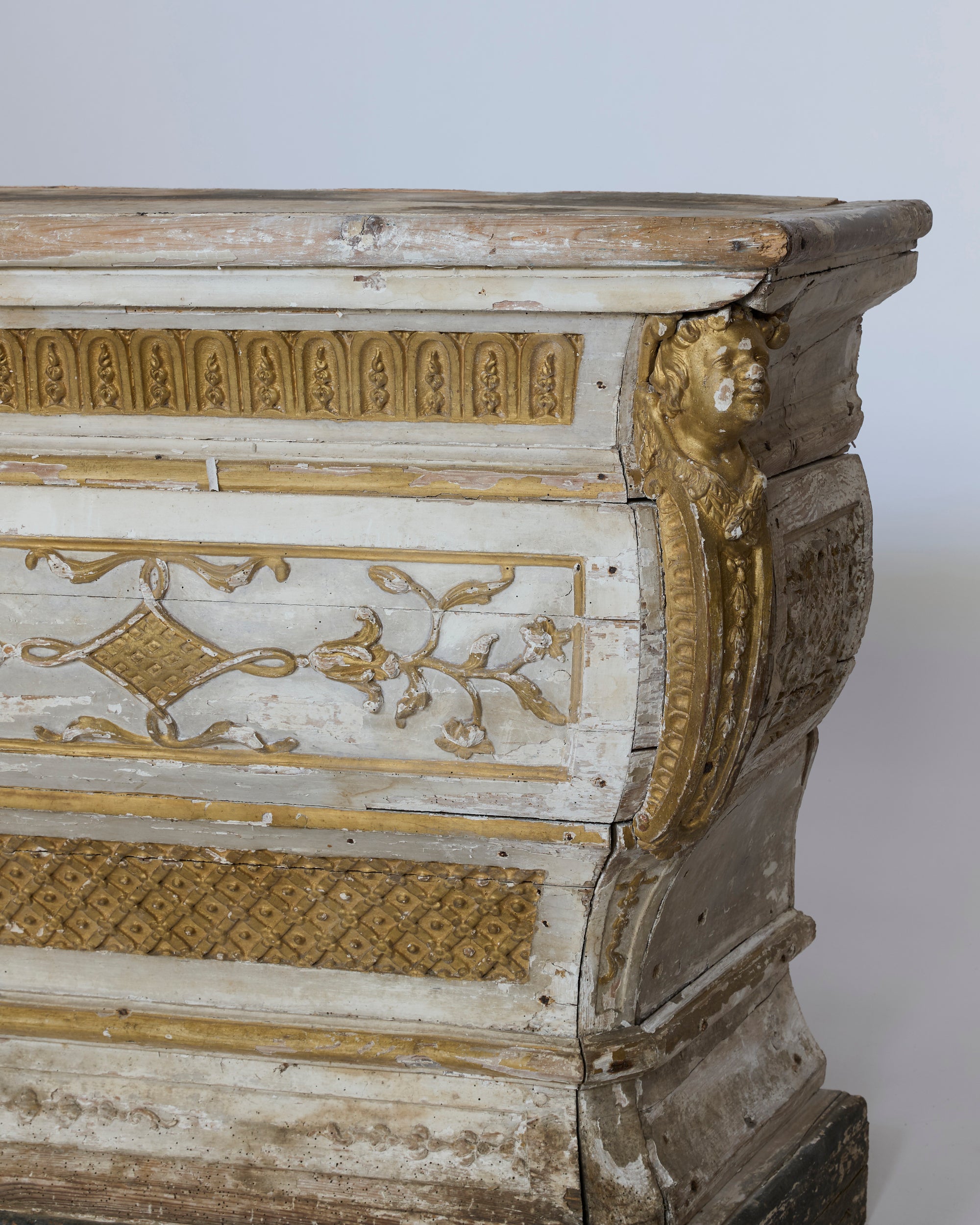 Decorative wooden chest with intricate carvings on a white background