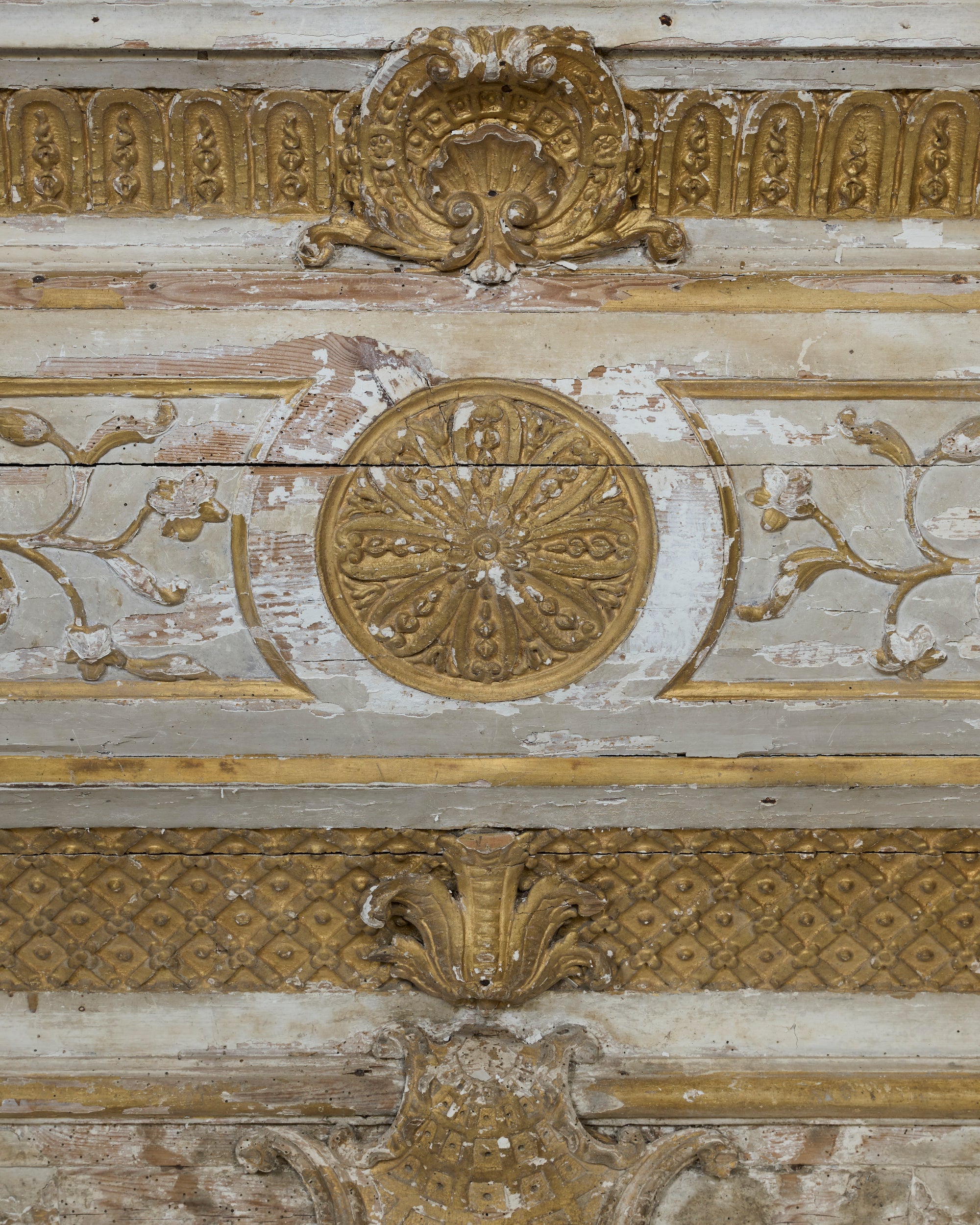 Decorative ceiling with gold and white patterns