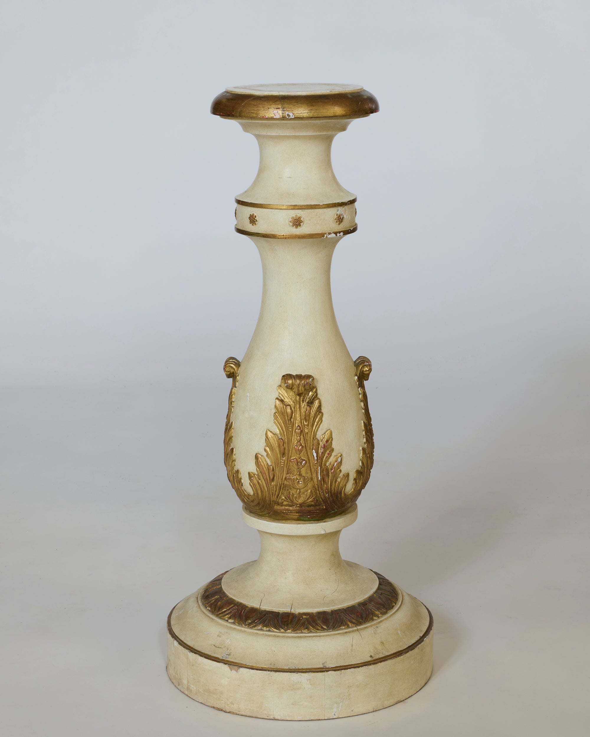 Decorative candlestick with gold accents on a white background