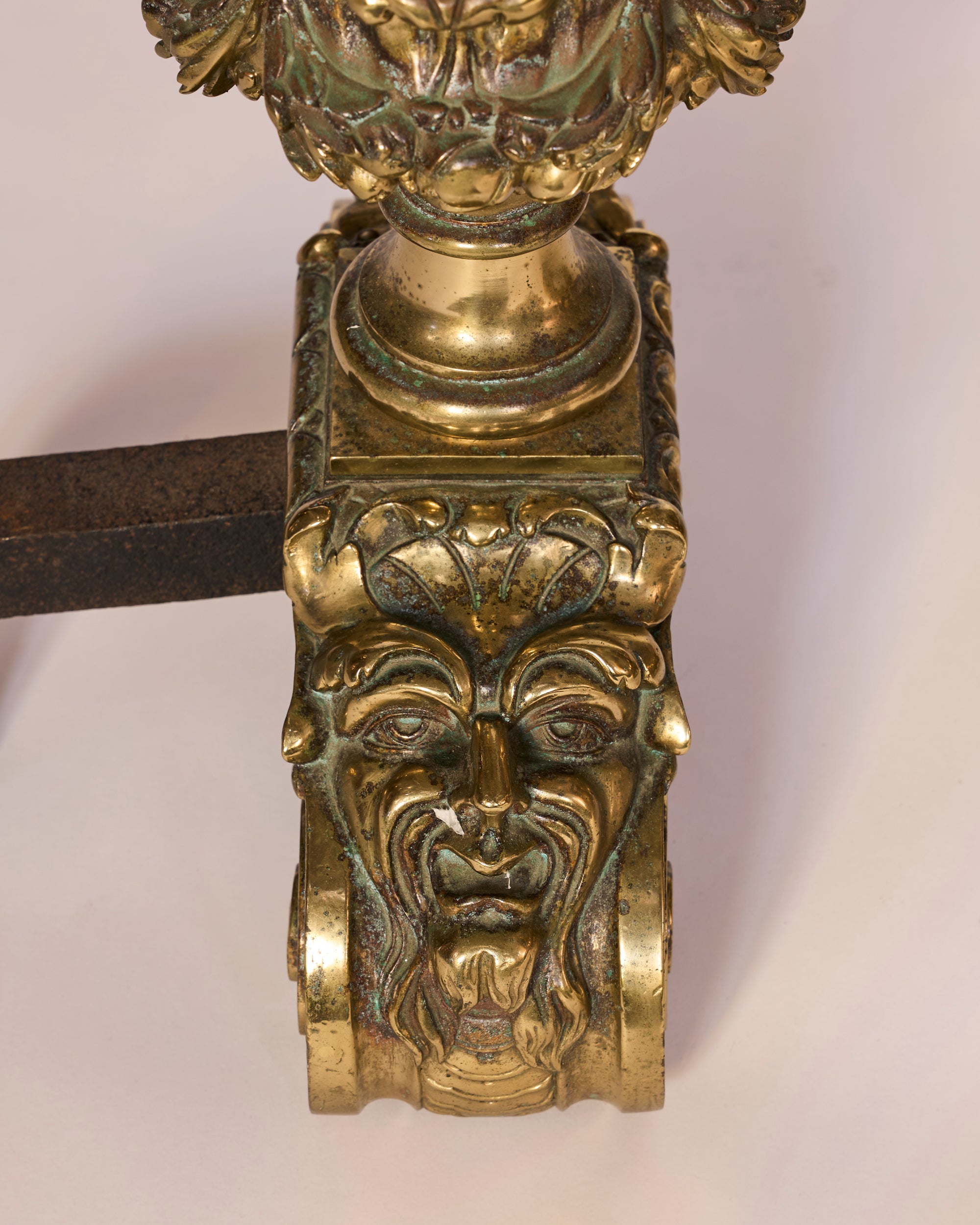 Decorative metal object with intricate designs on a white background