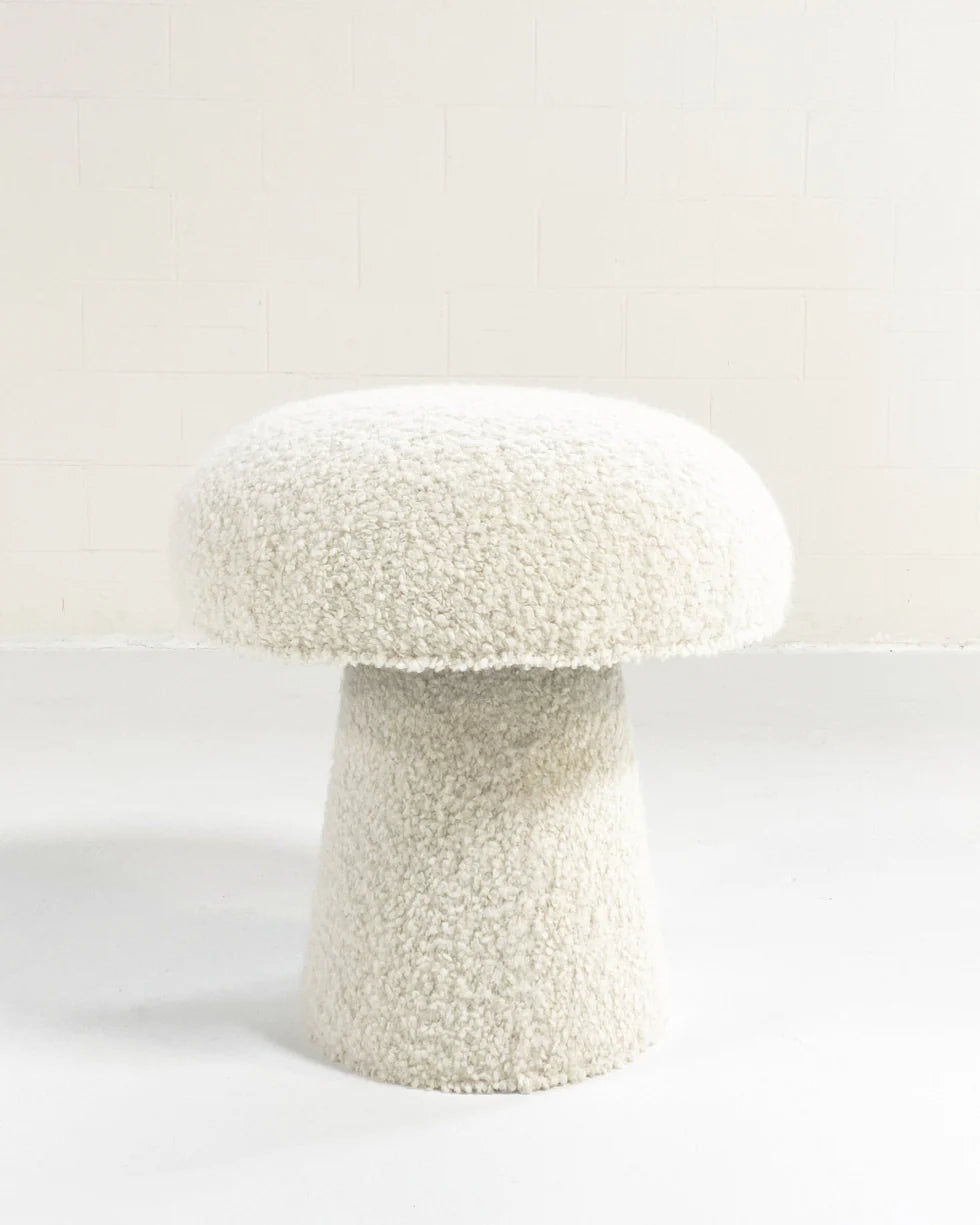 The Forsyth Mushroom Pouf in Boucle features a white, textured finish with a rounded top and tapered cylindrical base, shown against a plain white background.