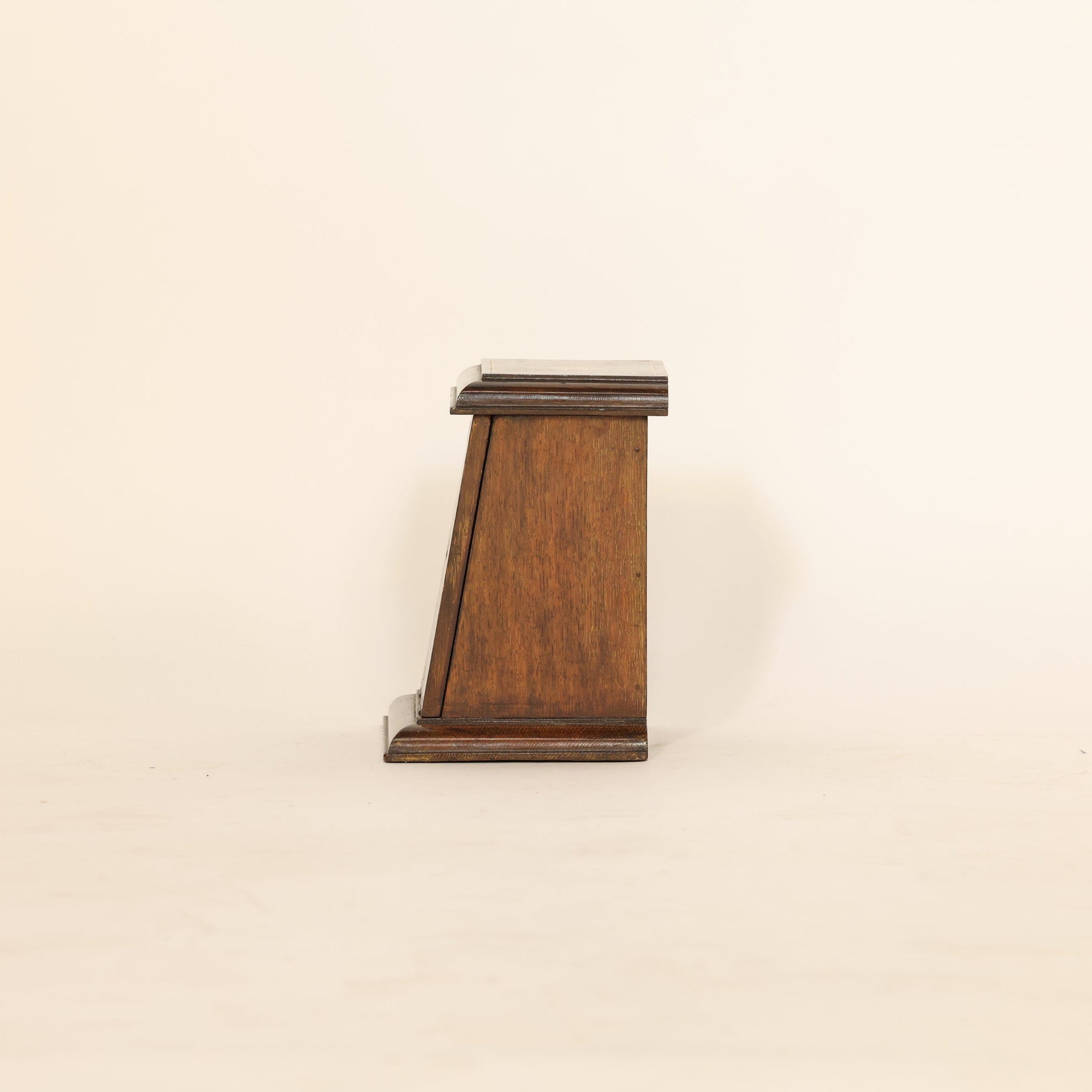 Side Profile Of Wooden Table Cabinet on Beige Background 