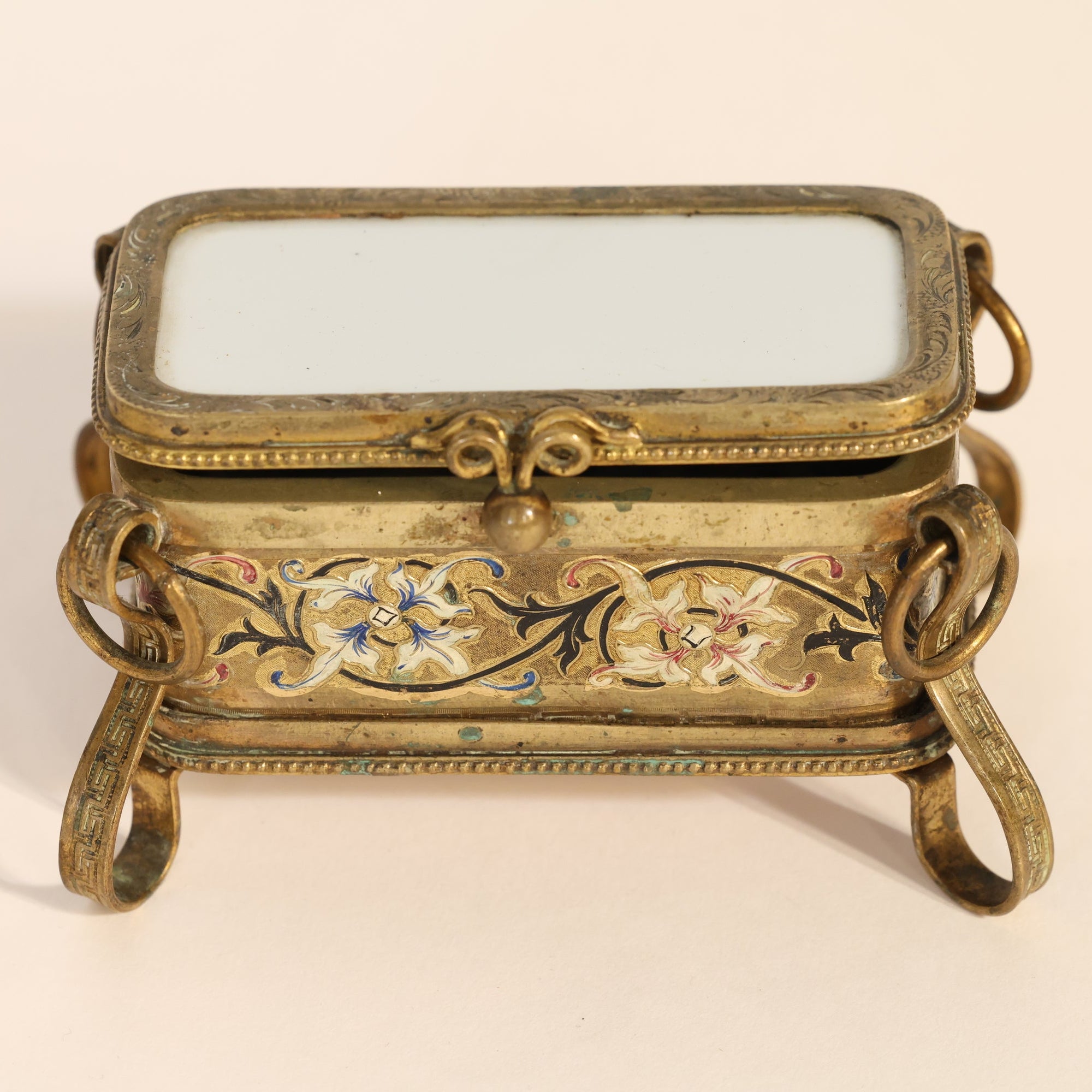 Decorative gold box on a beige background