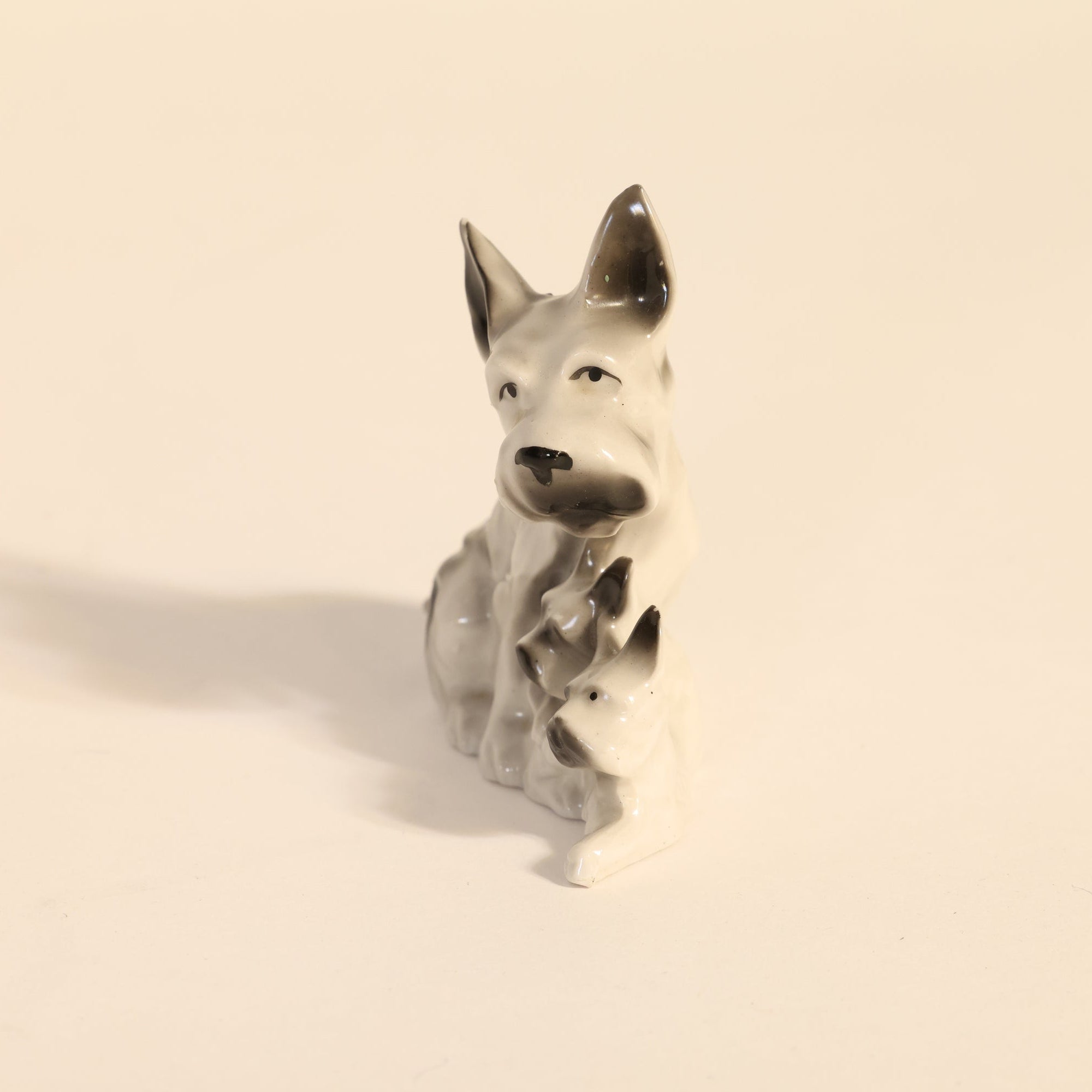 Dog-shaped figurine on a beige background