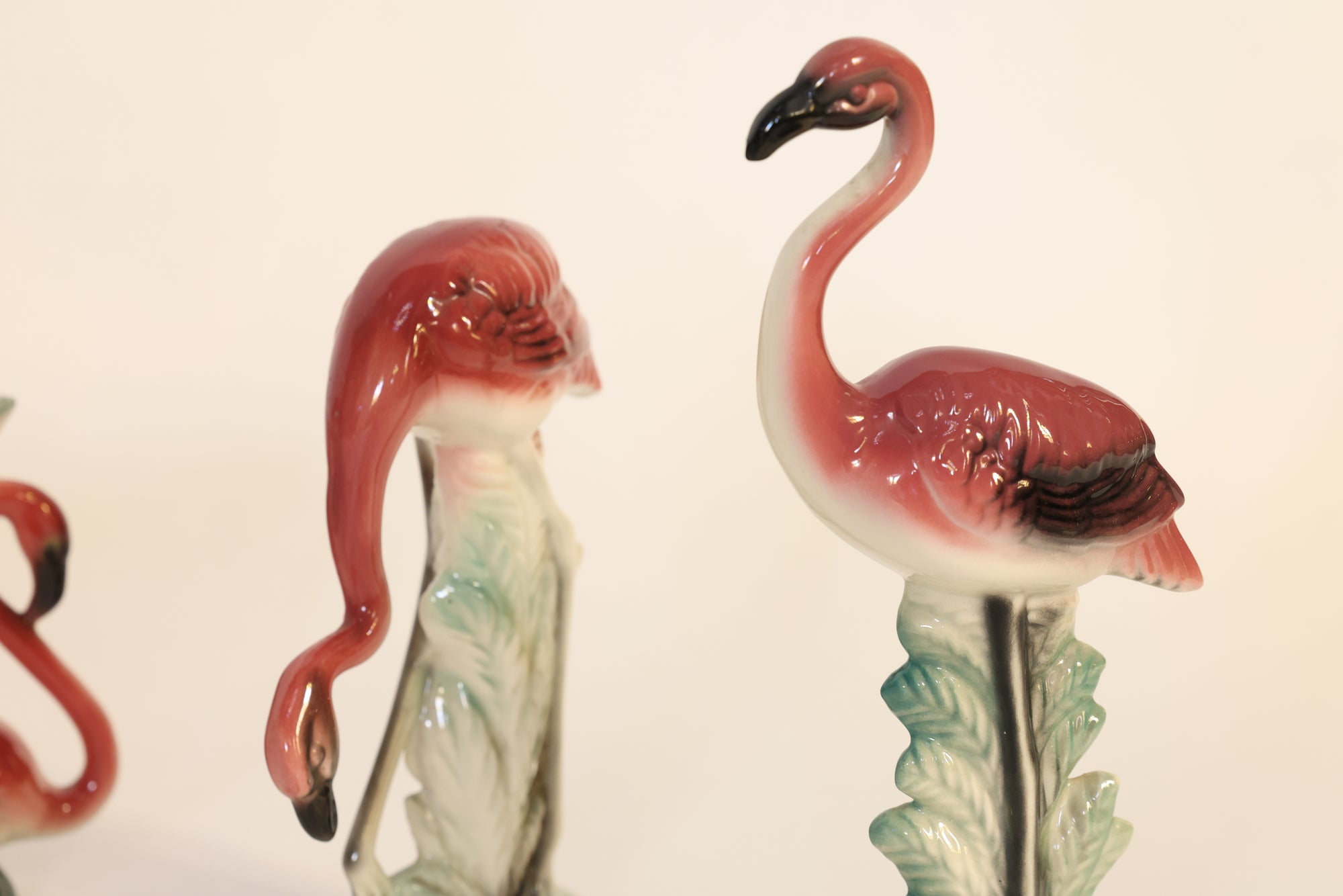 Flamingo-shaped figurines on a white background