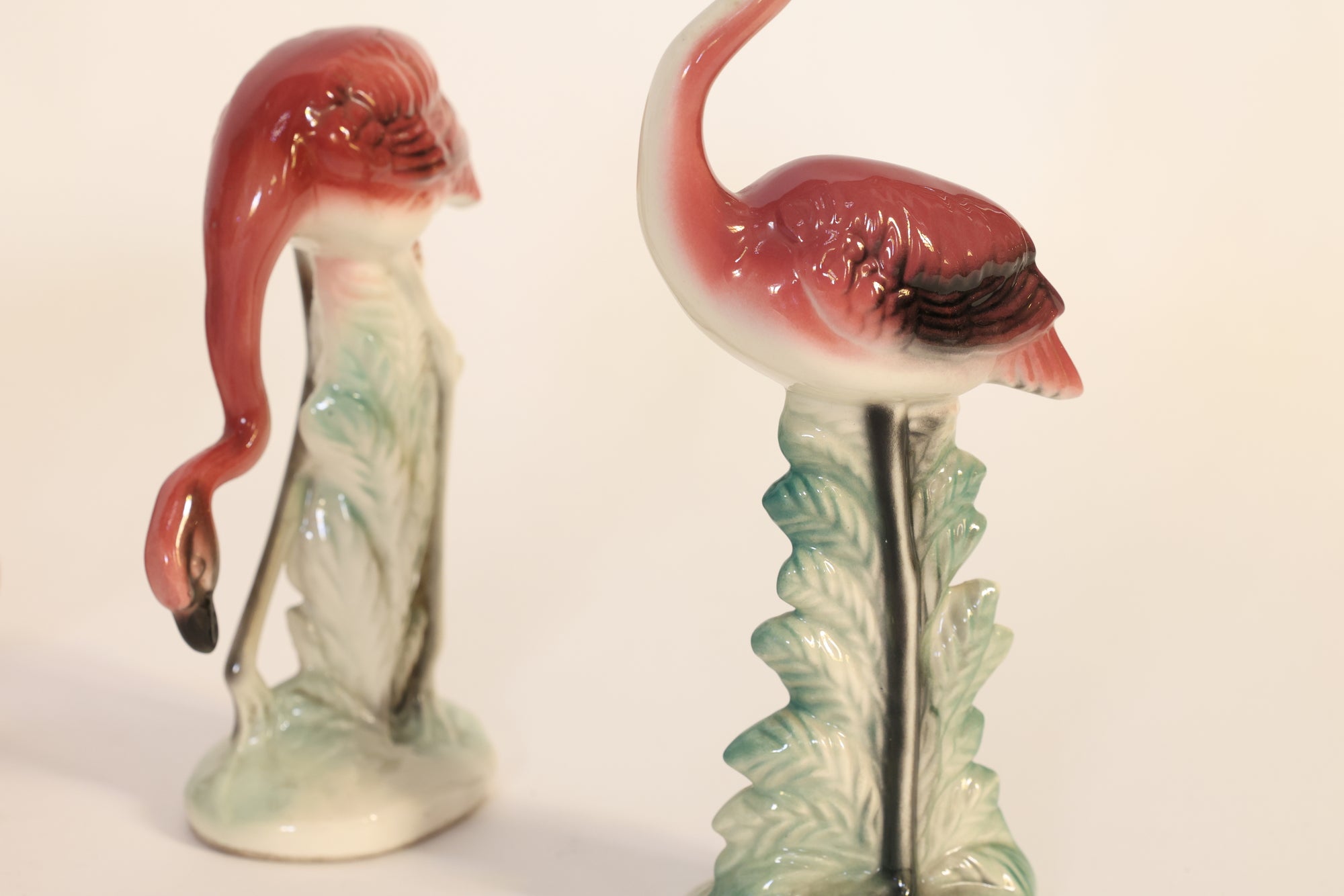 Flamingo-shaped figurines on a white background