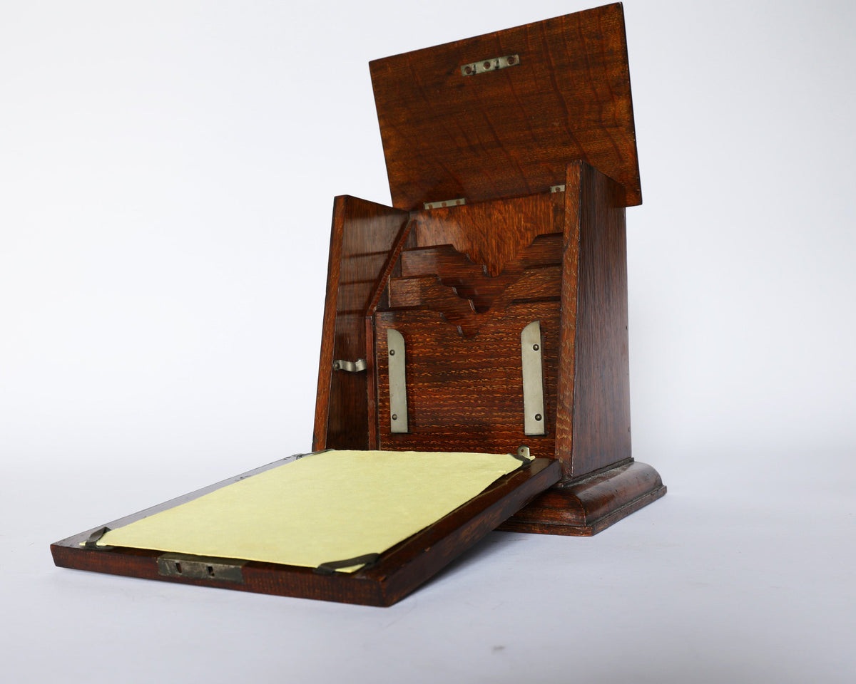The Euro Trash Antique Inlaid Wooden Document Box features an open lid and a slanted front panel showing a yellow paper sheet, beautifully crafted from inlaid wood and displayed on a plain white background.