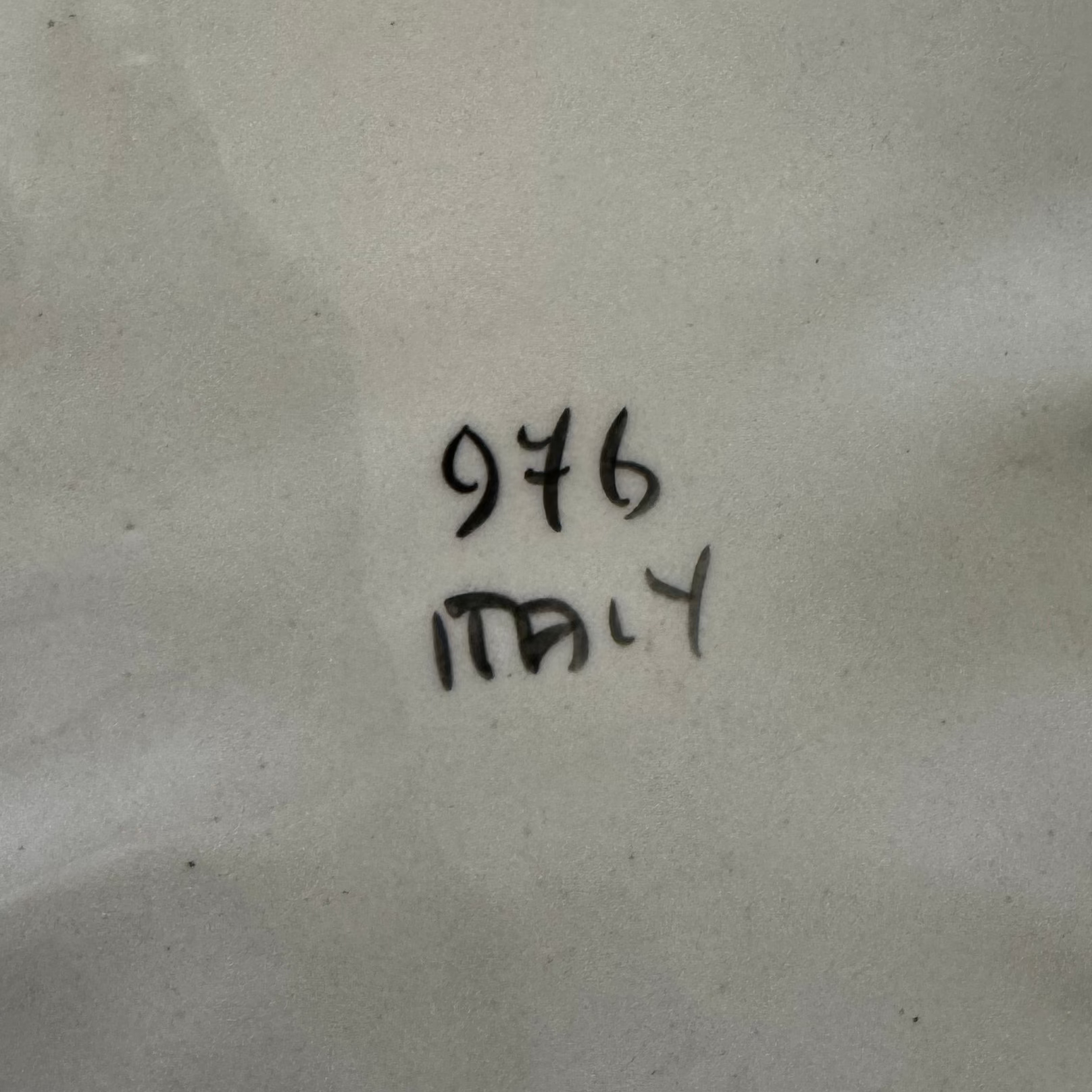 The handwritten numbers 976 appear above "Italy" on a lightly wrinkled surface, possibly marking the Euro Trash Antique White Glazed Baroque Style Centerpiece Bowl.
