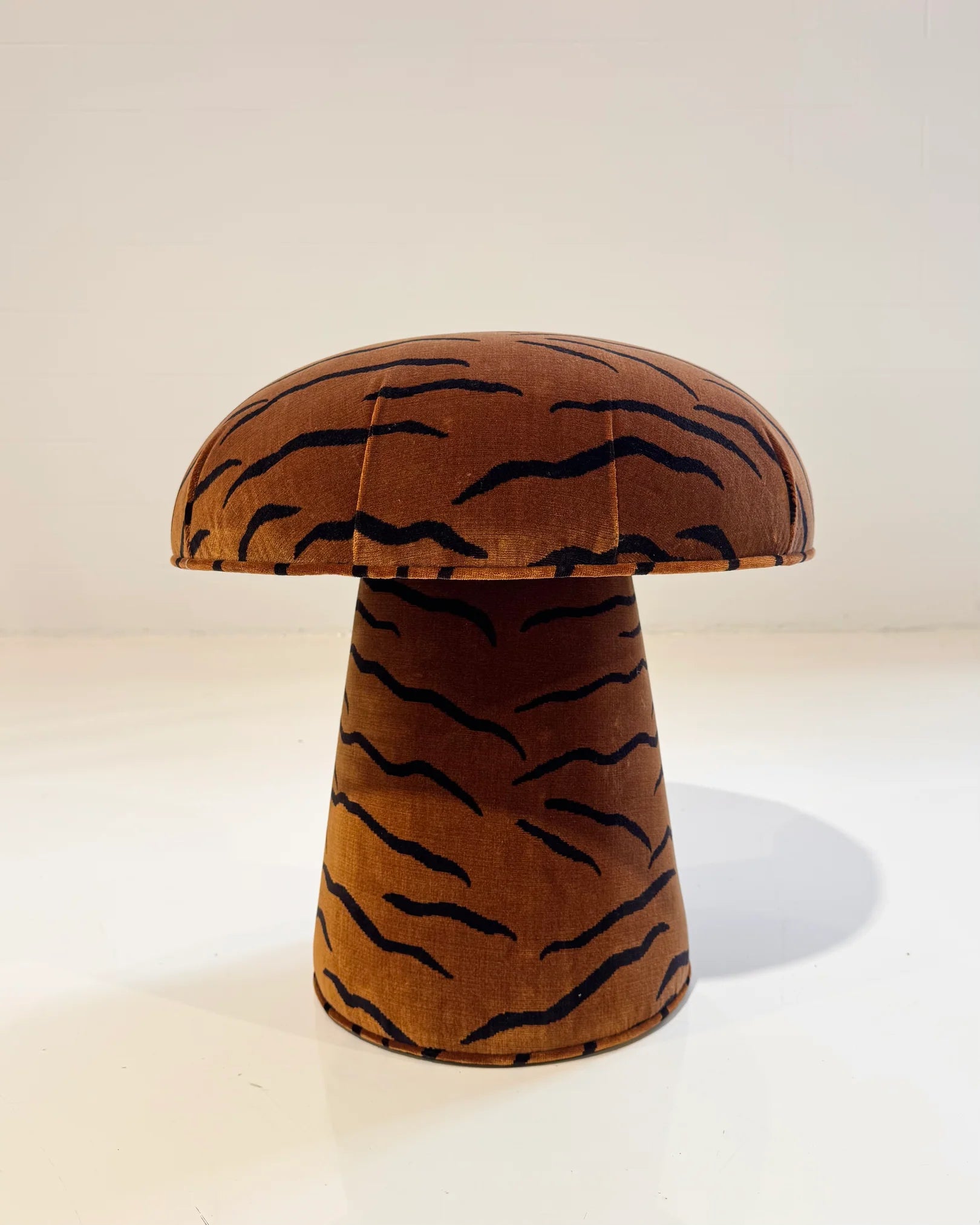 The Forsyth Mushroom Pouf in Dedar 'A Tiger In The Orangerie' features a brown jacquard velvet cover with black wavy tiger-stripe patterns, shown against a plain white background.