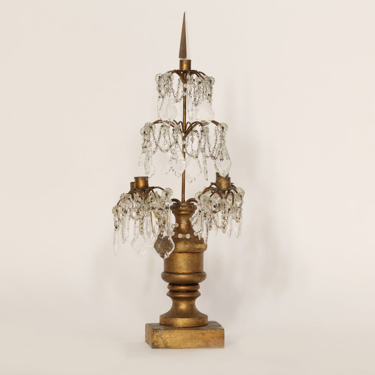 Decorative candelabra with crystal accents on a beige background