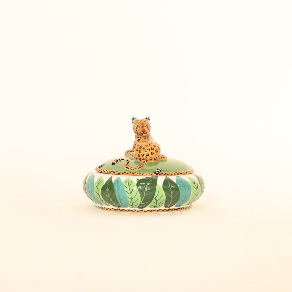 Decorative box with a leopard design on a beige background