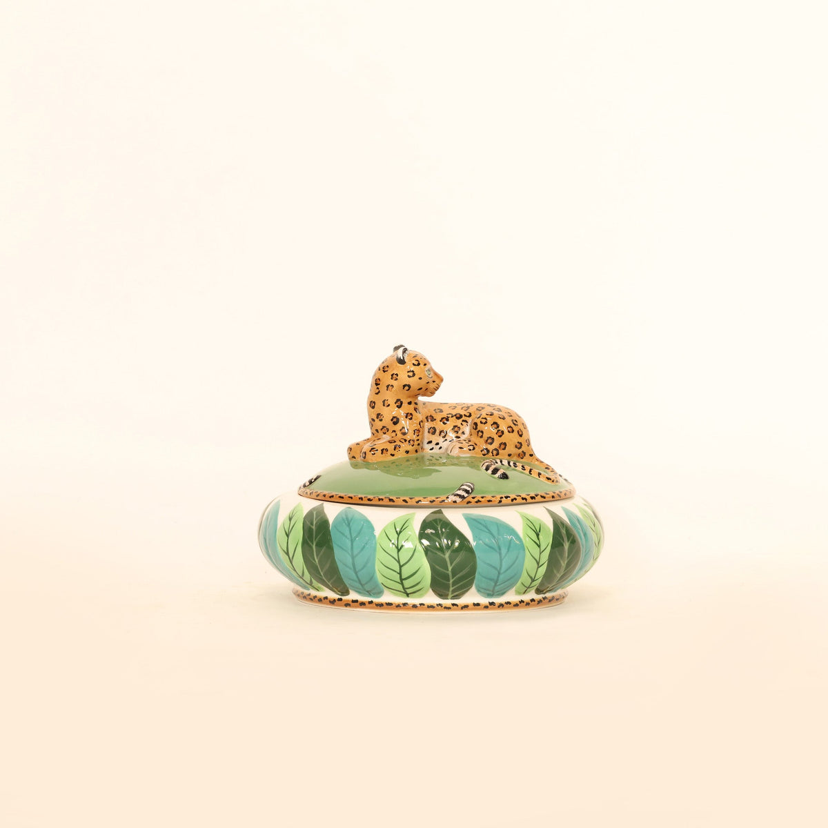 Decorative box with a leopard design on a beige background