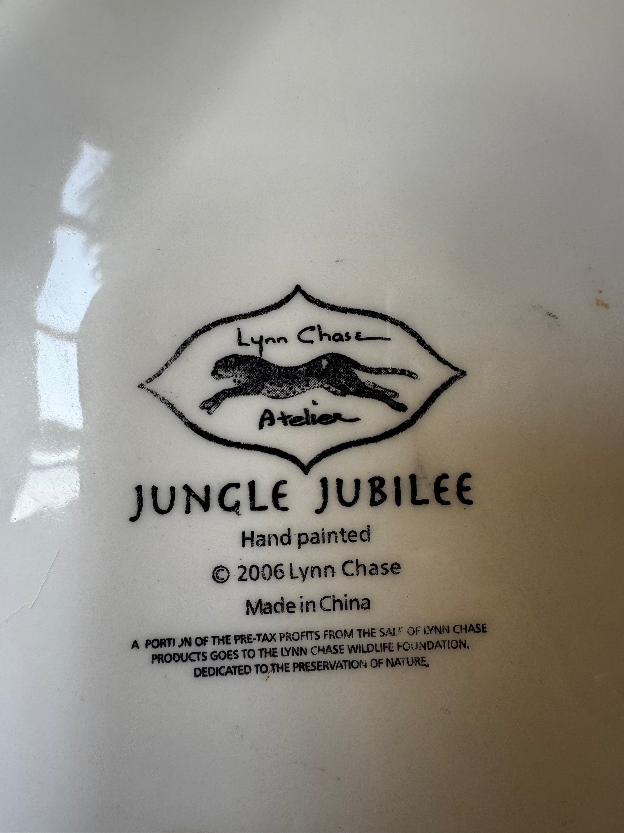 Black text on white reads Euro Trash Annie with a drawing of a hand-painted leopard. Below: Hand-Painted Leopard Motif Porcelain Trinket Box; Made in China; profits support wildlife—ideal as decor or a trinket box.