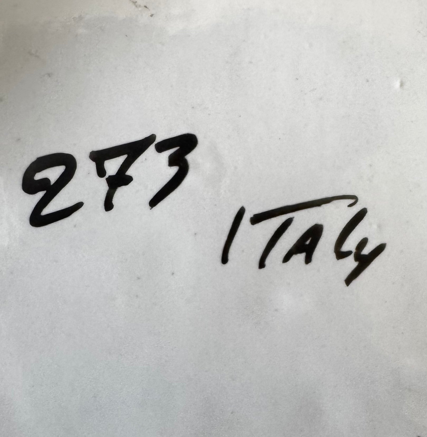 Black handwritten text on a white surface reads 273 (left) and Italy (right), beside the Late 20th Century White Ceramic Tulip Arrangement by Euro Trash Annie.