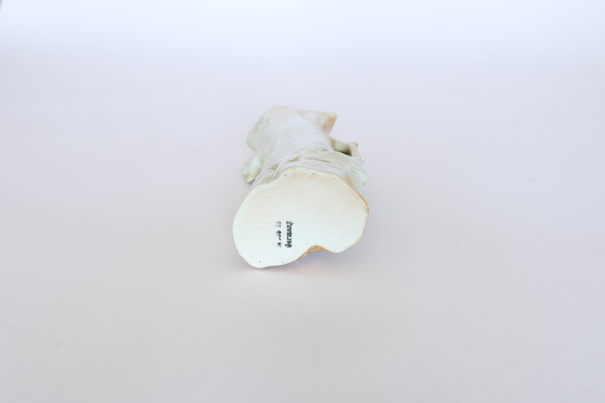 A pair of vintage ceramic hand-painted bird vases by Euro Trash are shown on their sides against a white background, bases with visible markings—ideal for those who love cottage décor and unique collectible pieces.