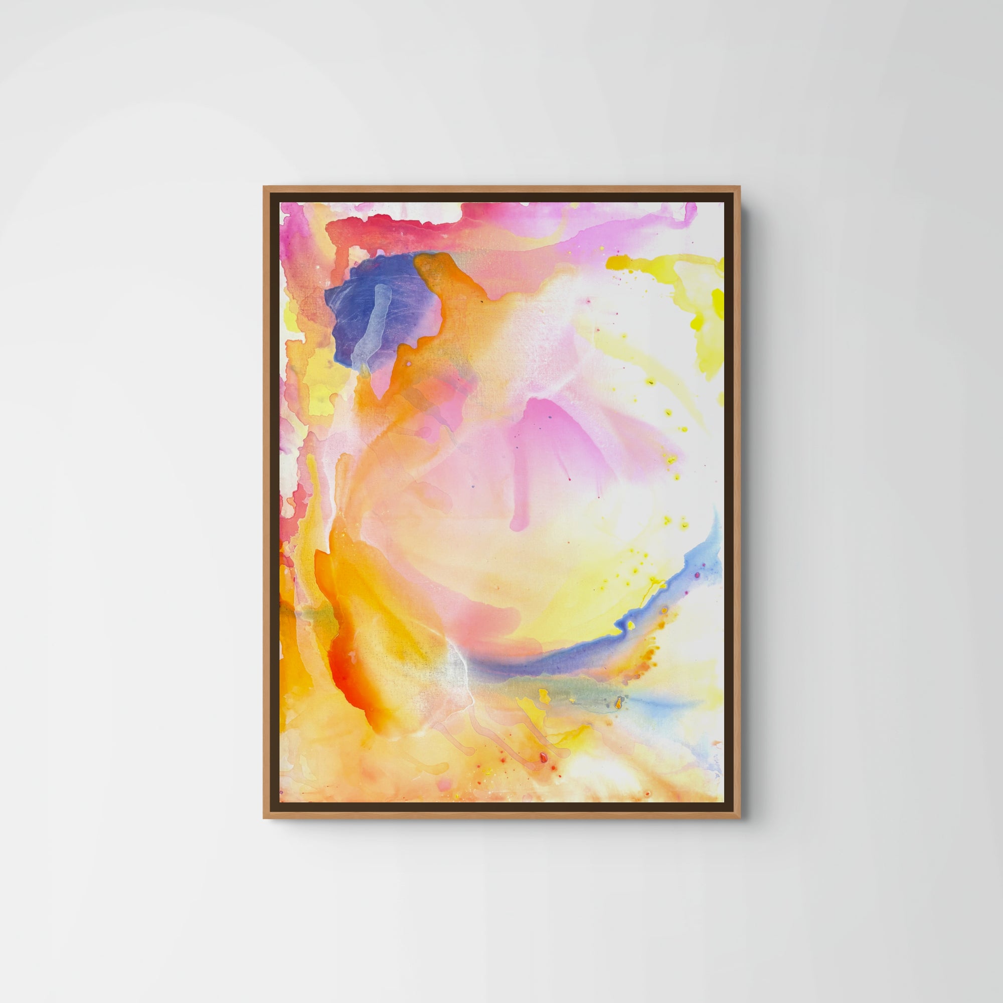 Start of Sunset" by Euro Trash, a framed original acrylic painting featuring vibrant splashes of yellow, orange, pink, and blue in a swirling sunset style, hangs on a plain white wall.