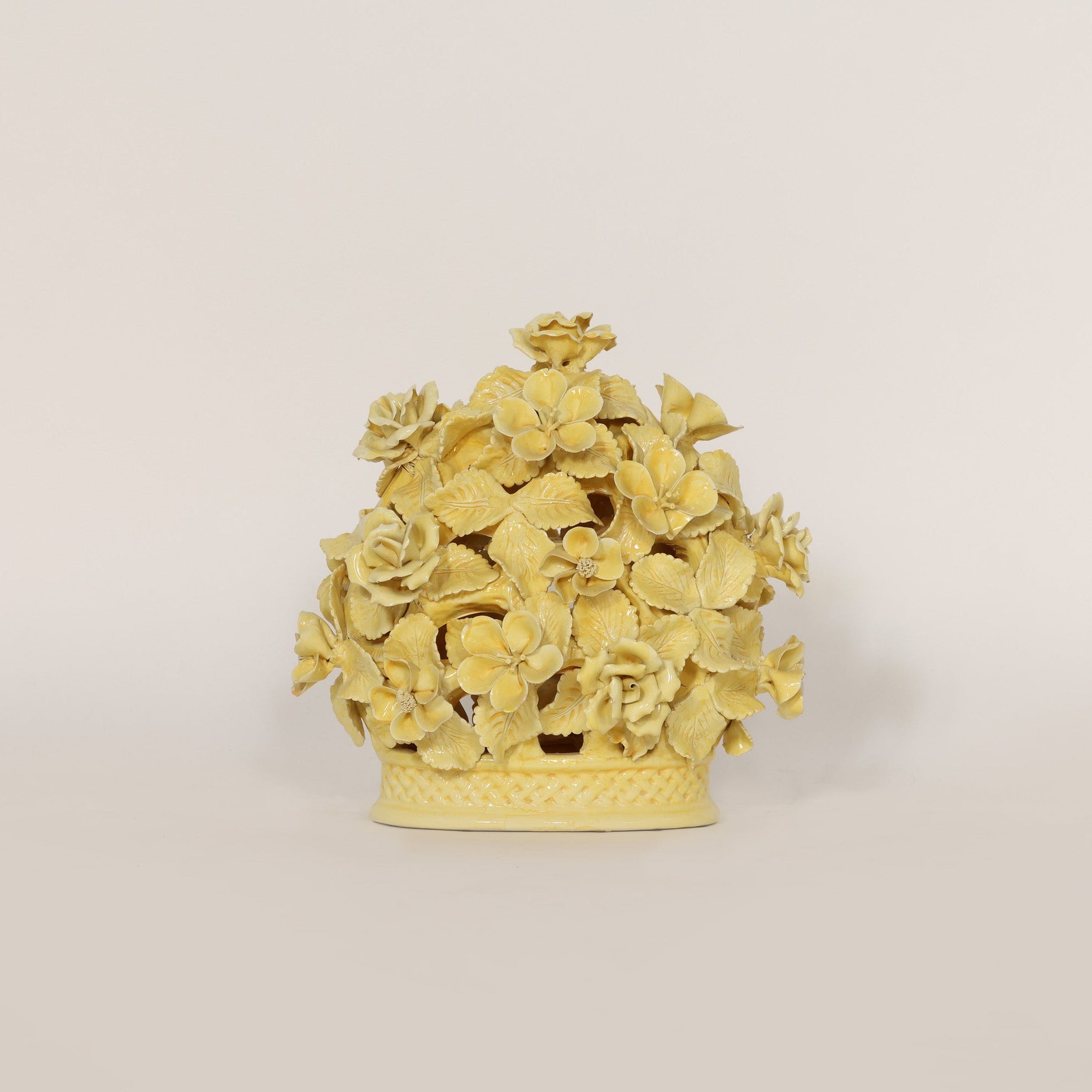 Decorative yellow floral object on a beige background
