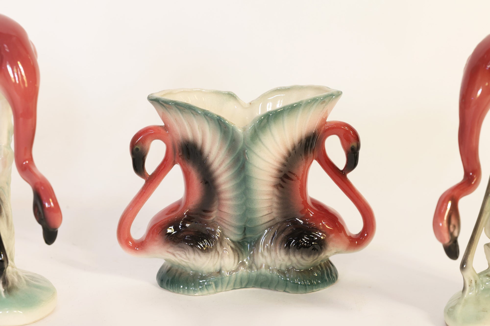 Flamingo-shaped ceramic vase on a white background