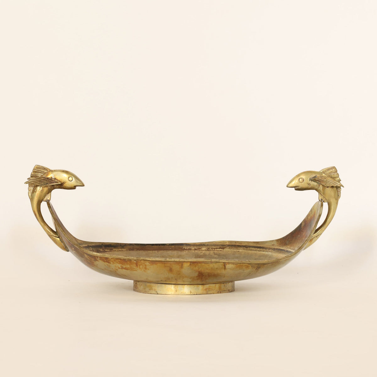 vintage brass centerpiece bowl on a beige background