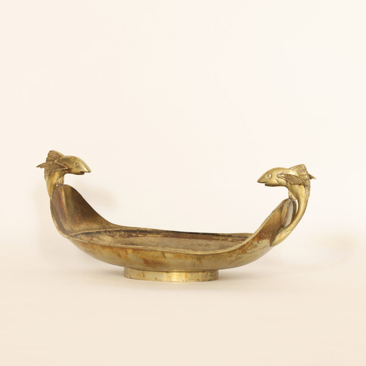 vintage brass centerpiece bowl on a beige background