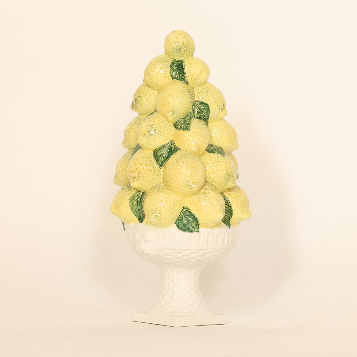 Decorative object resembling a lemon tree on a white background