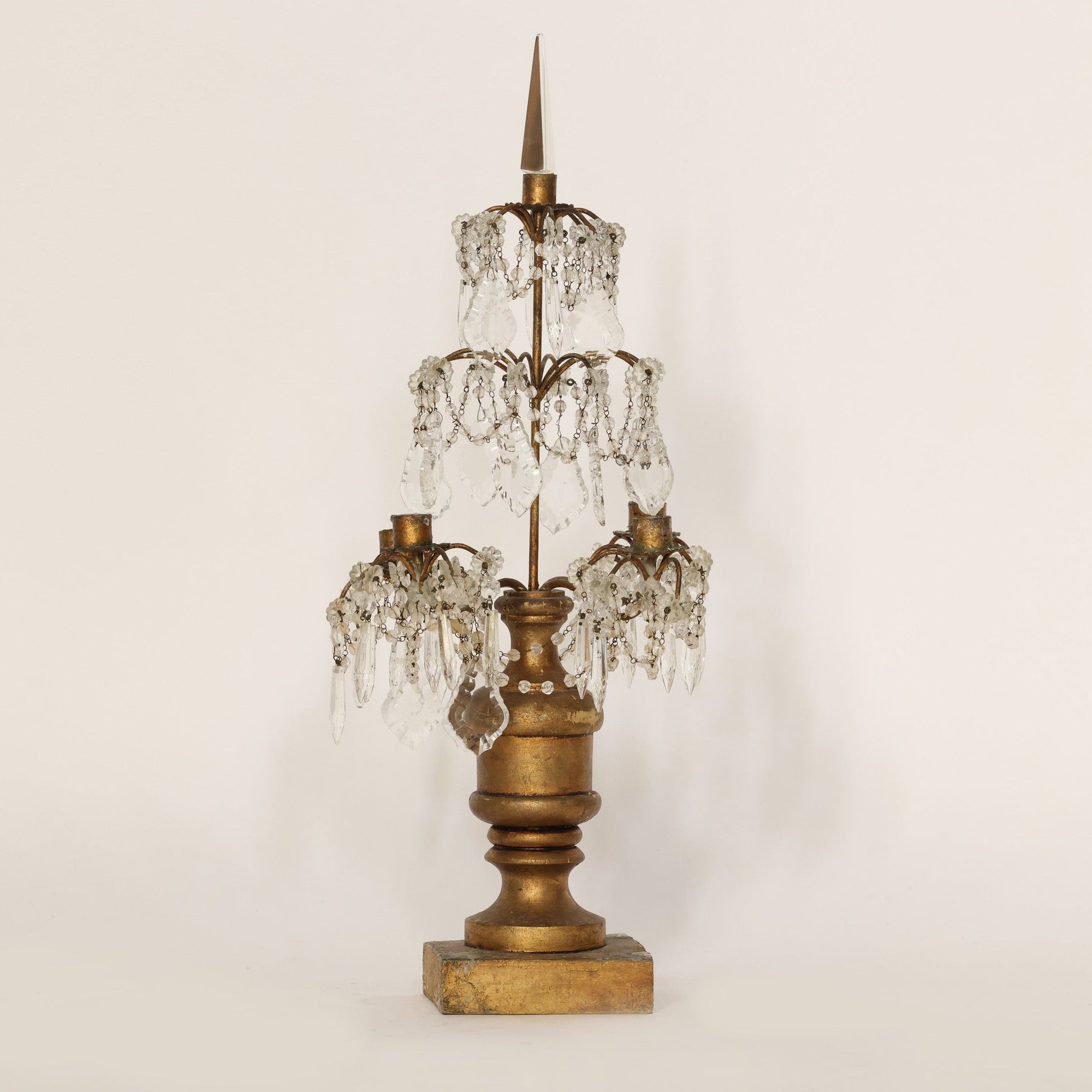 Decorative candelabra with crystal accents on a beige background