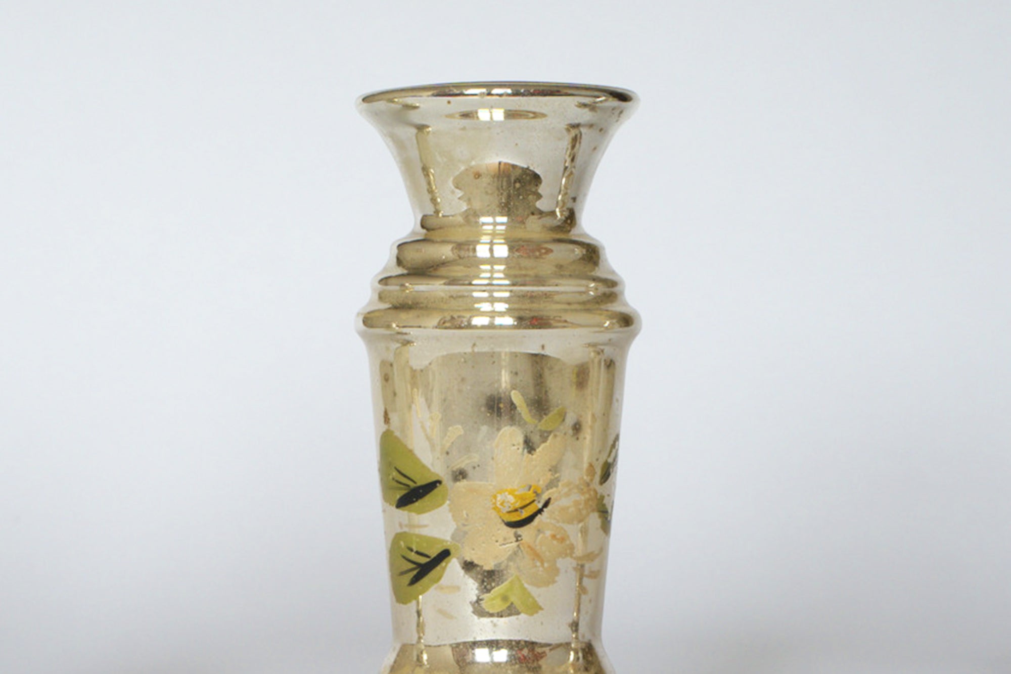The Euro Trash Vintage Hand-Painted Mercury Glass Vase Set features gold-toned vases with narrow necks, flared rims, and floral designs of white and yellow flowers with green leaves, inspired by vintage mercury glass styles.