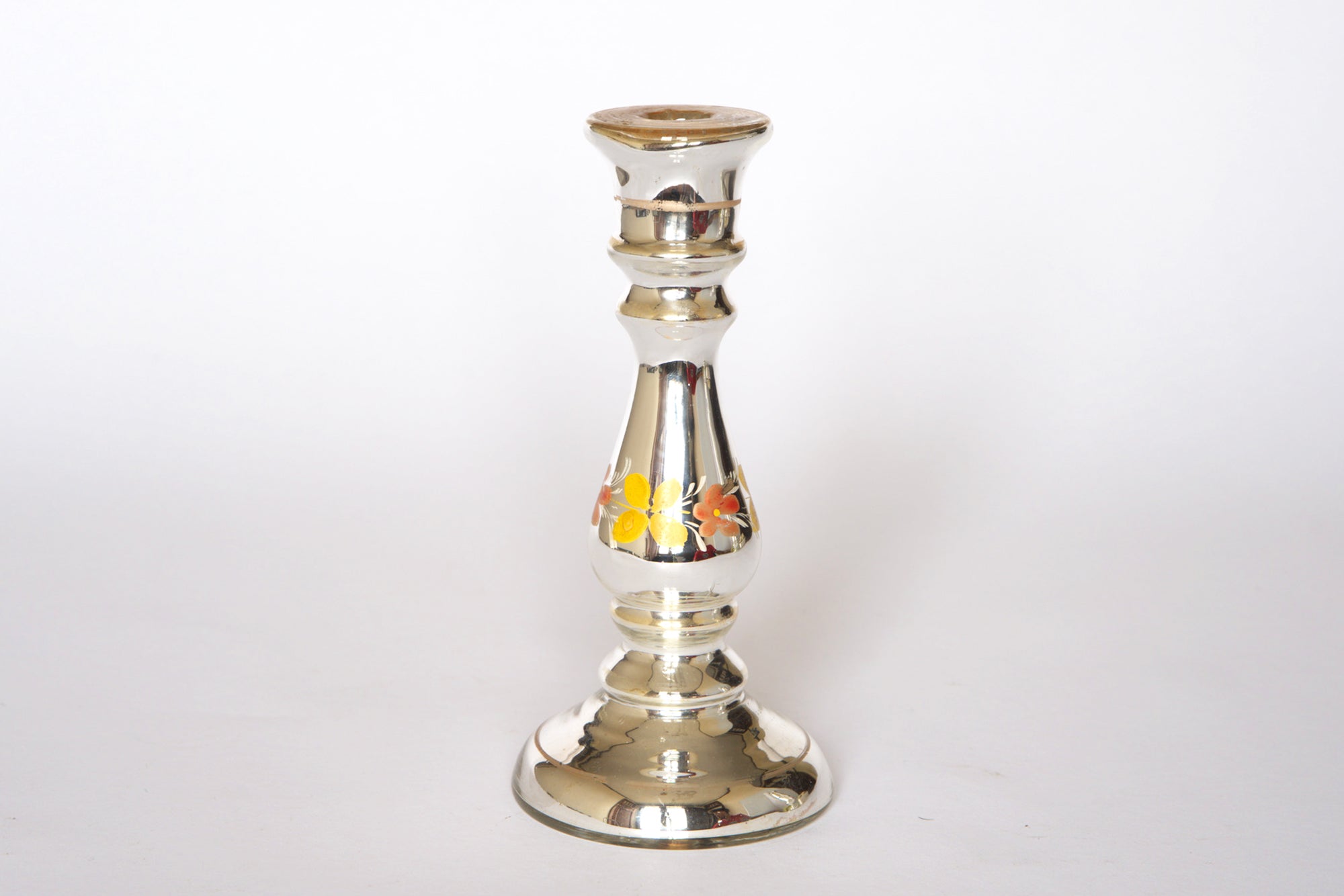A pair of vintage silver mercury glass vases by Euro Trash, featuring sculptural design and hand-painted yellow and orange floral details, stand upright on a plain white background.