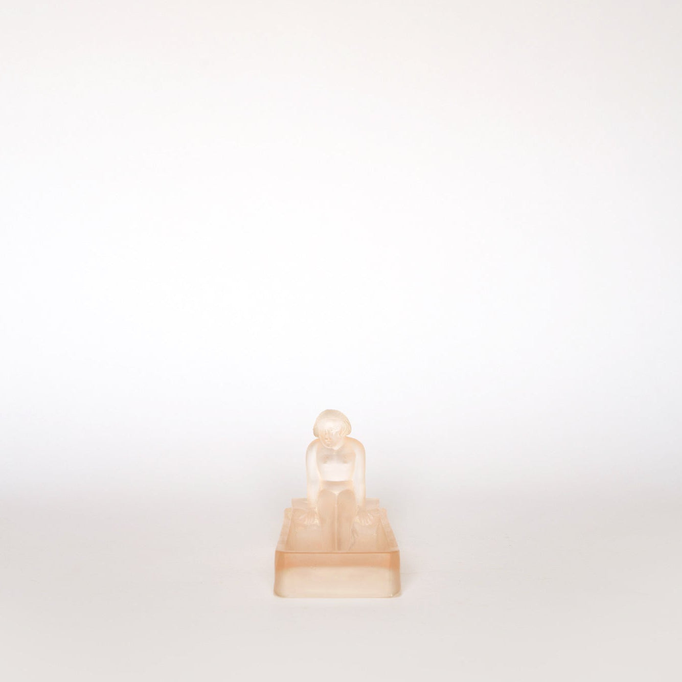 The Euro Trash Vintage Frosted Glass Figural Trinket Dish sits centered on a plain, light background with plenty of empty space surrounding it.
