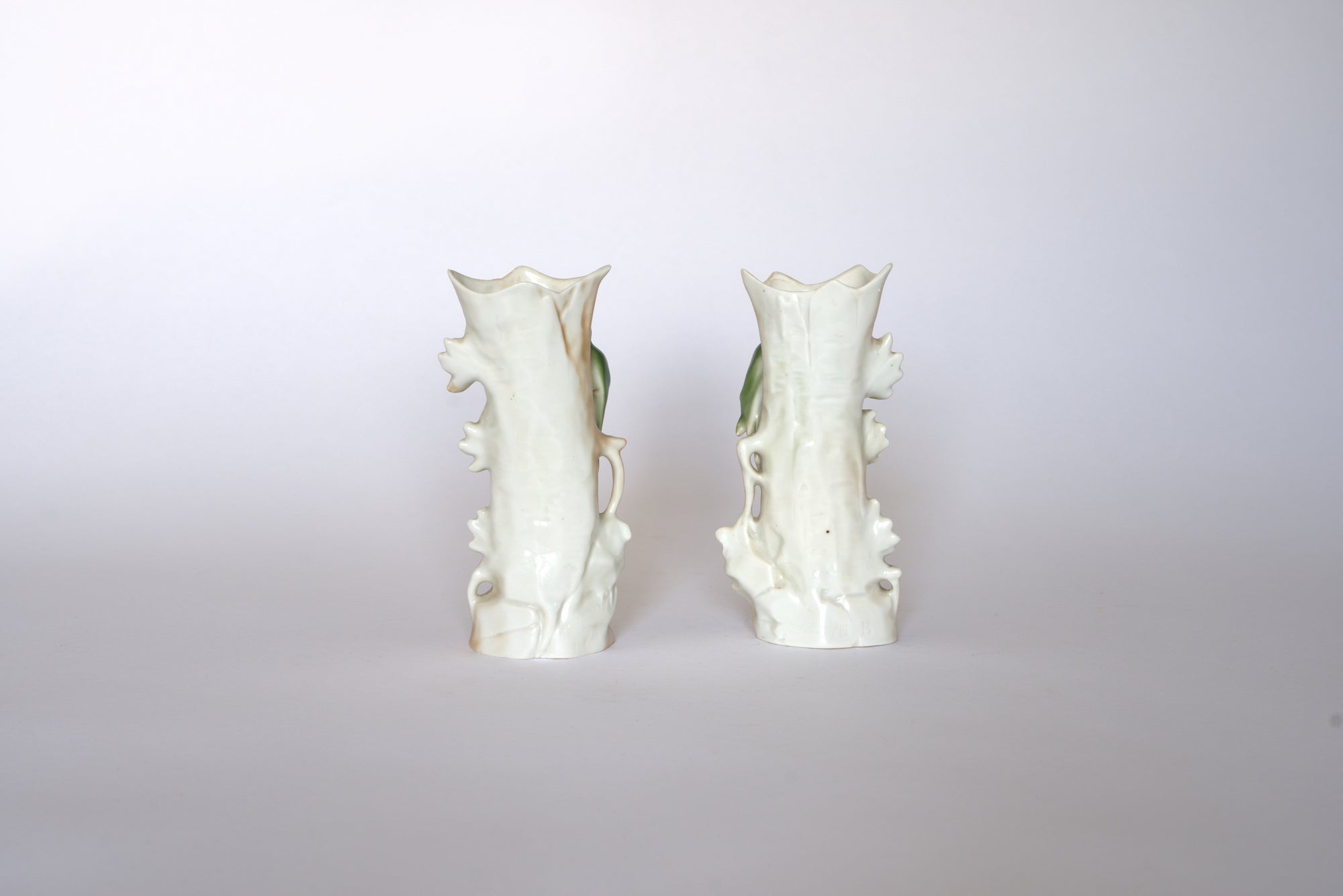The Euro Trash Pair of Vintage Ceramic Hand-Painted Bird Vases stand side by side against a light background, showcasing their charming cottage aesthetic.